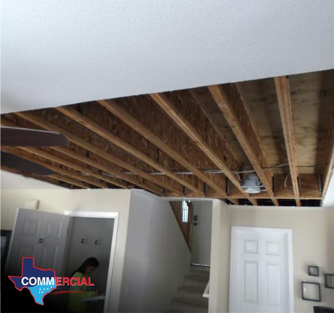 Austin storm damage restoration with ceiling joists exposed