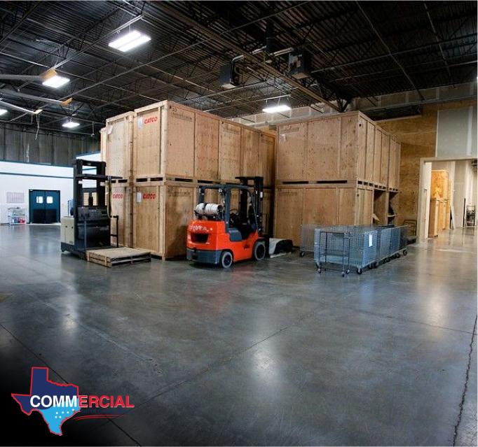Business flood cleanup in a warehouse with stacked crates