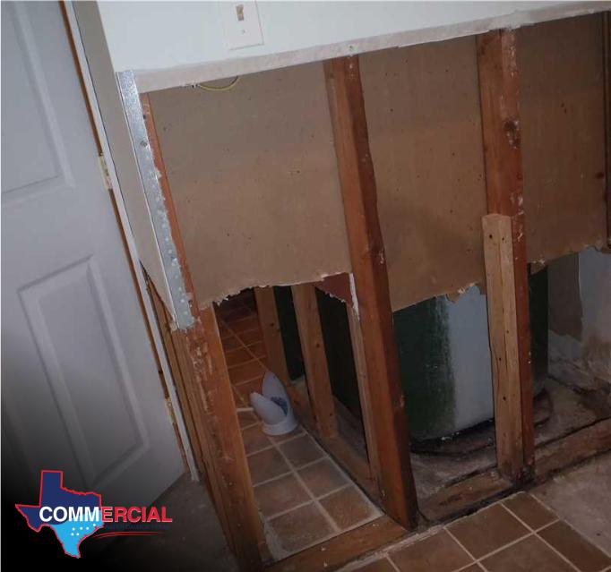 Opened wall showing hidden water damage